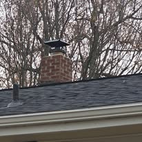 Finished chimney cap and flashing on a new roof by Rockstar Roofing in Northeast Ohio