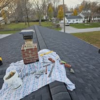 Chimney flashing and ridge vent work on a new roof by Rockstar Roofing