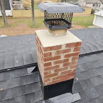 Chimney cap and flashing repair with new shingles by Rockstar Roofing