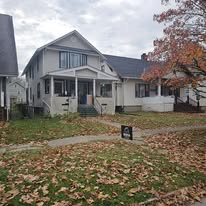 Completed roof replacement with Rockstar Roofing yard sign in Northeast Ohio